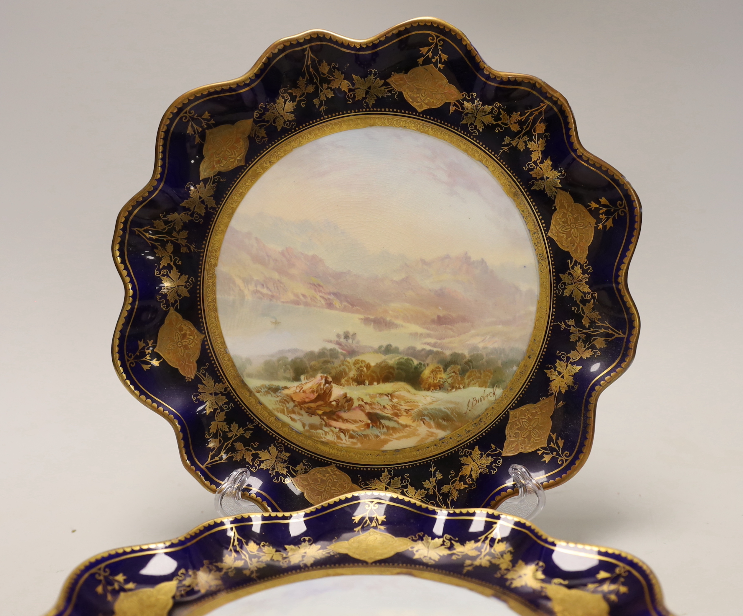 A set of four Victorian bone china cabinet plates, each painted with a named view by J Birbeck